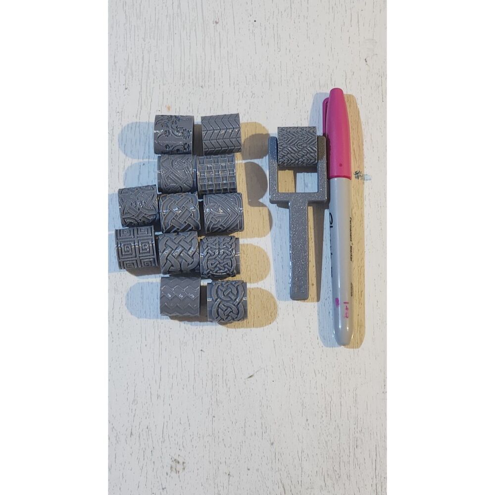 Interchangeable clay texture roller stamp pattern cylinders and a matching handl